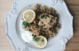 Greek Style Chicken and Rice on a white plate