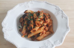 Tomato Porchini and Eggplant Penne on a white plate