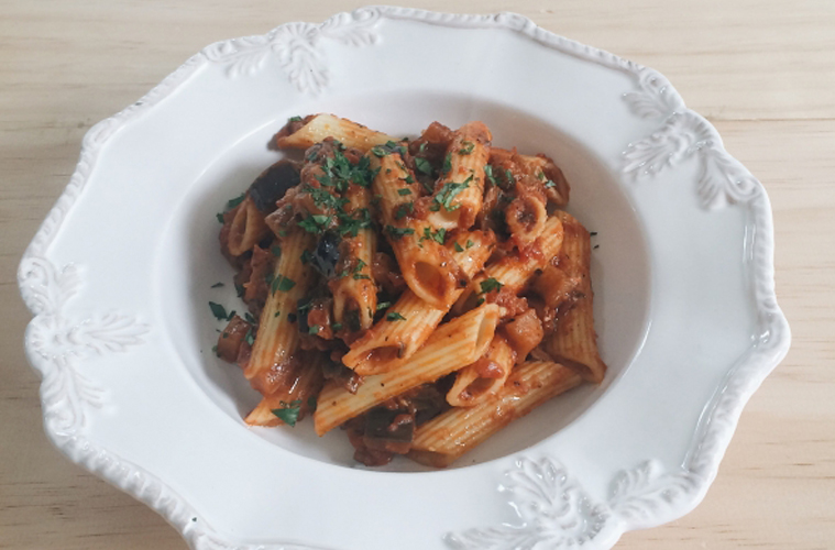 Tomato Porchini and Eggplant Penne on a white plate