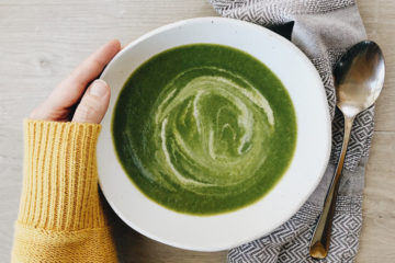 green soup in a white bowl