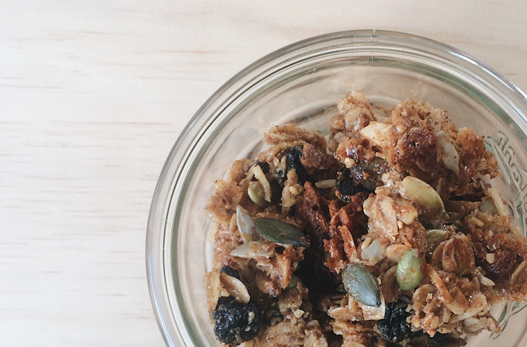 hazelnut and sour cherry granola in a weck jar on a wooden surface