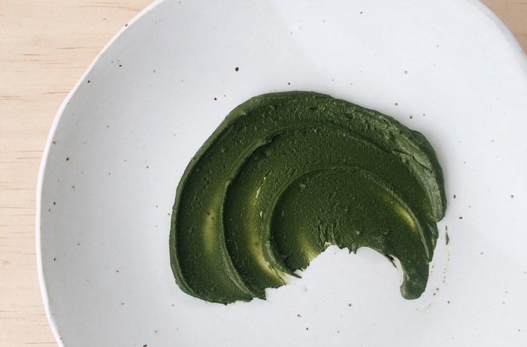 matcha face mask in a swirl on a white plate