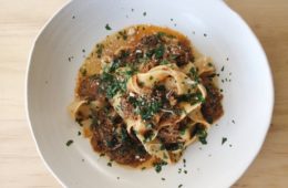 Beef Ribs with Pappardelle on a white plate