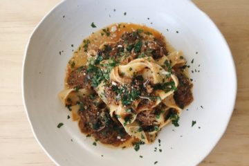 Beef Ribs with Pappardelle on a white plate