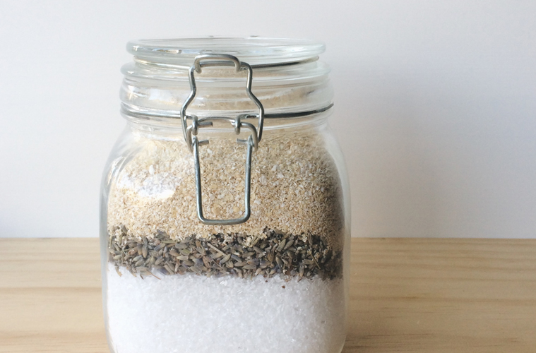soothing bath salts in a glass jar on a wooden surface