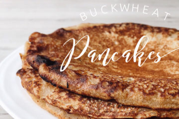 buckwheat pancakes stacked on a white plate