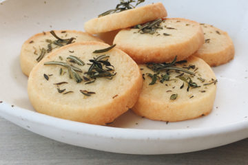 Parmesan Biscuits piled on a white plate