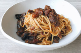 Beef Ribs with spaghetti in a white bowl