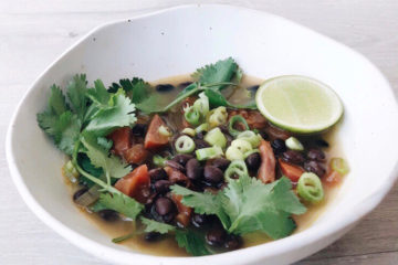 chorizo and black bean soup in a white bowl