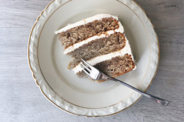 vegan hummingbird cake on a vintage plate with a fork