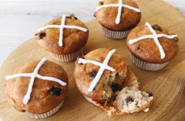 hot cross muffins on a wooden board
