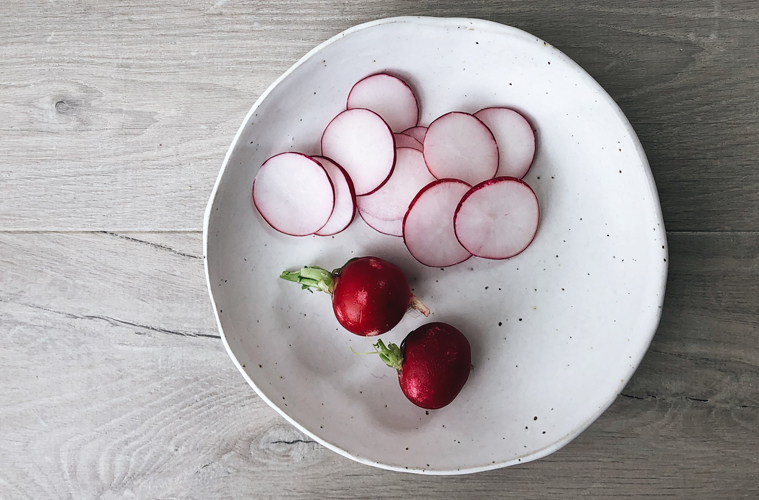 radishes on a white plate