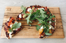 cheat's pizza on a wooden board