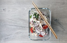 turkey thai noodle salad in glass container with chopsticks