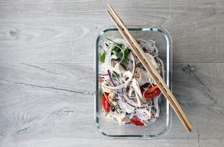 turkey thai noodle salad in glass container with chopsticks