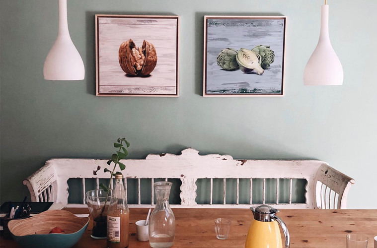 walnut and artichoke paintings on the wall