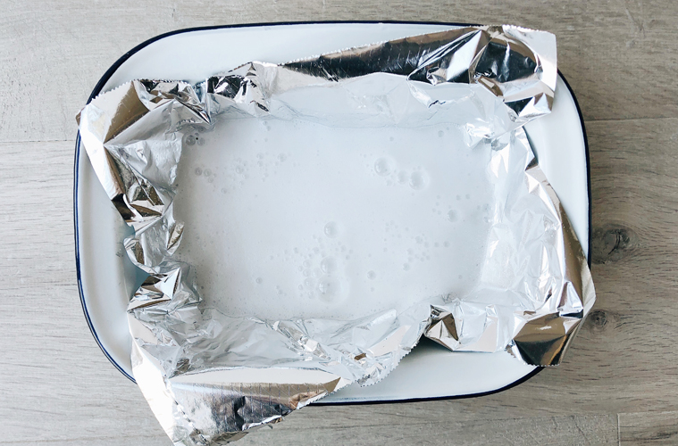 bicarb and vinegar bubbles in aluminium foil lined bowl